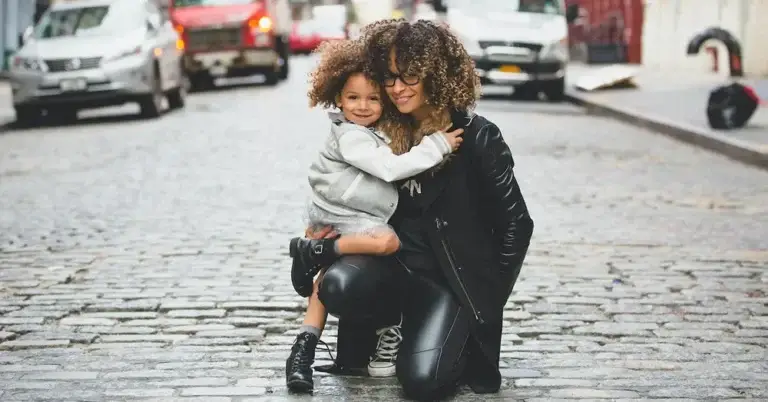 A mother with her child, creating an example for setting healthy boundaries.