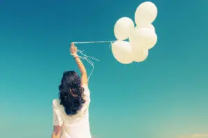 The image shows a woman who successfully manages unhealthy relationships effectively