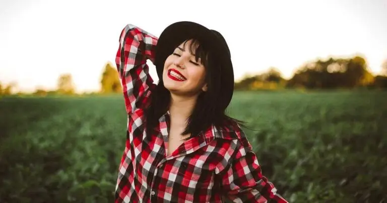 The image shows a happy individual who successfully uses trauma counselling strategies.