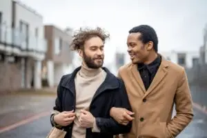 The image shows a gay couple who knows what is complex trauma.