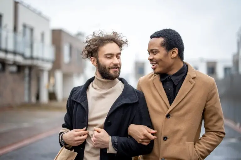 The image shows a gay couple who knows what is complex trauma.