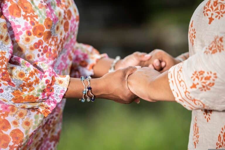 Two people holding hands, symbolizing the support of affordable complex trauma counselling.