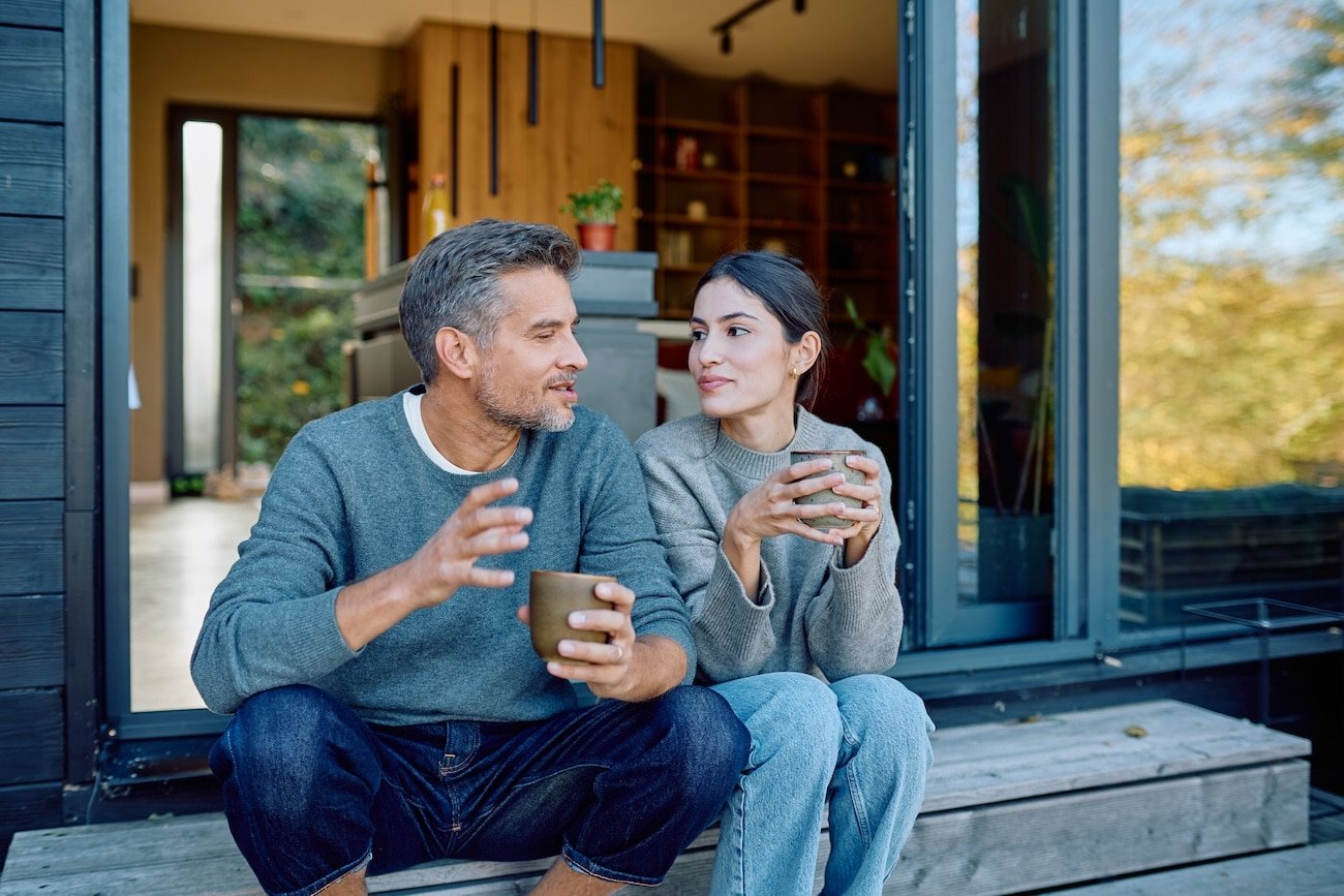 Couple outside, enjoying themselves after trauma-informed relationship coaching process.
